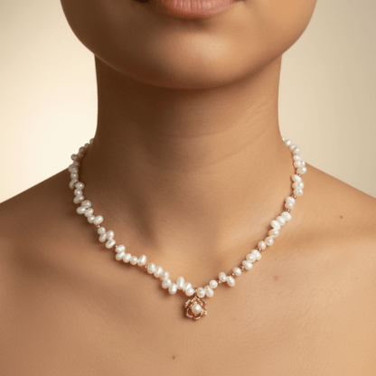 Elegant Camellia pearl necklace featuring natural baroque pearls and a sculpted gold bloom design