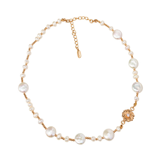 Gold vermeil necklace of coin and round freshwater pearls with small gold beads and a sculpted daisy connector