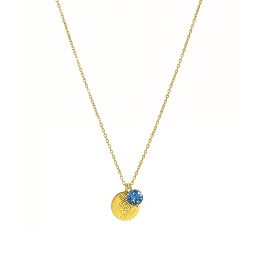 gold birth month necklace with blue crystal and engraved flower pendant