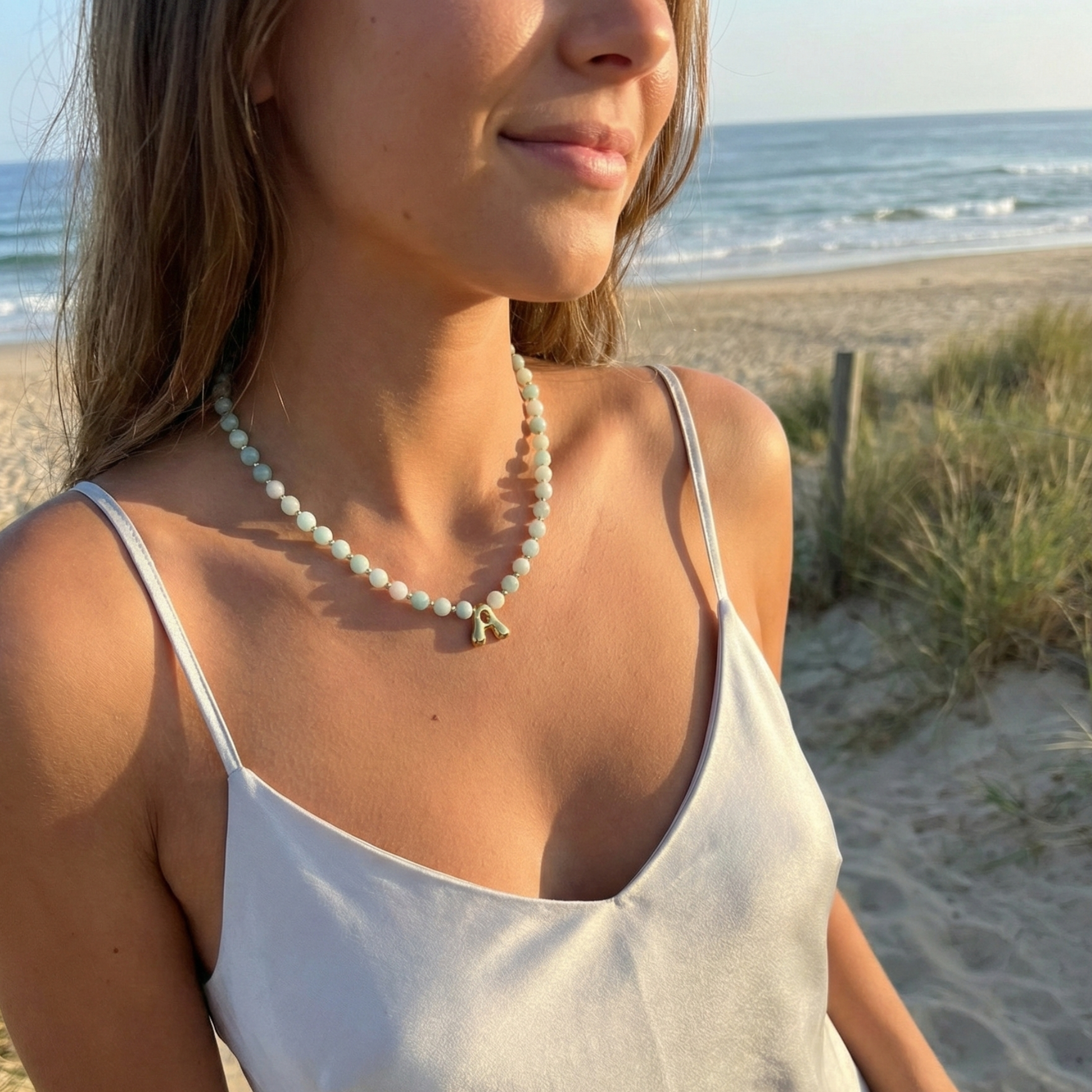 Amazonite beaded necklace with gold bubble initial pendant and gold filled spacer beads by MXW Jewellery