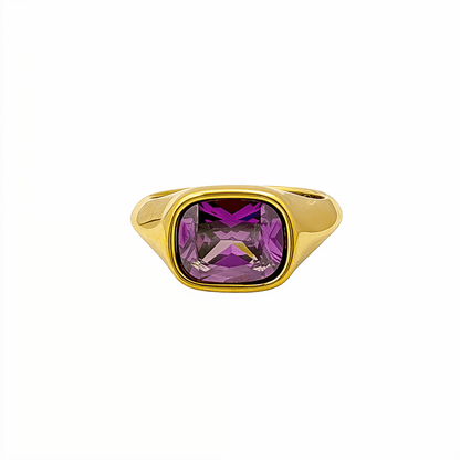Gold ring with a cushion-cut amethyst-purple zircon gemstone.