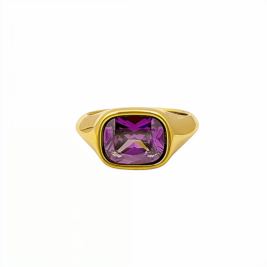 Gold ring with a cushion-cut amethyst-purple zircon gemstone.
