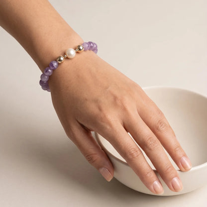 A beaded bracelet featuring Amethyst beads, premium freshwater pearl, and stamped initial disc, 14k gold filled. MXW Jewellery.