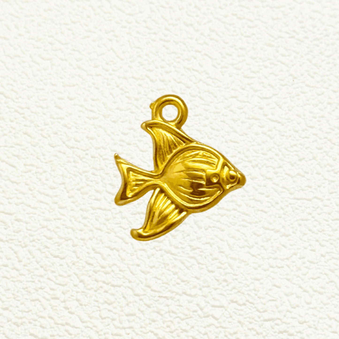 Gold angelfish charm with a smooth surface and detailed fin design