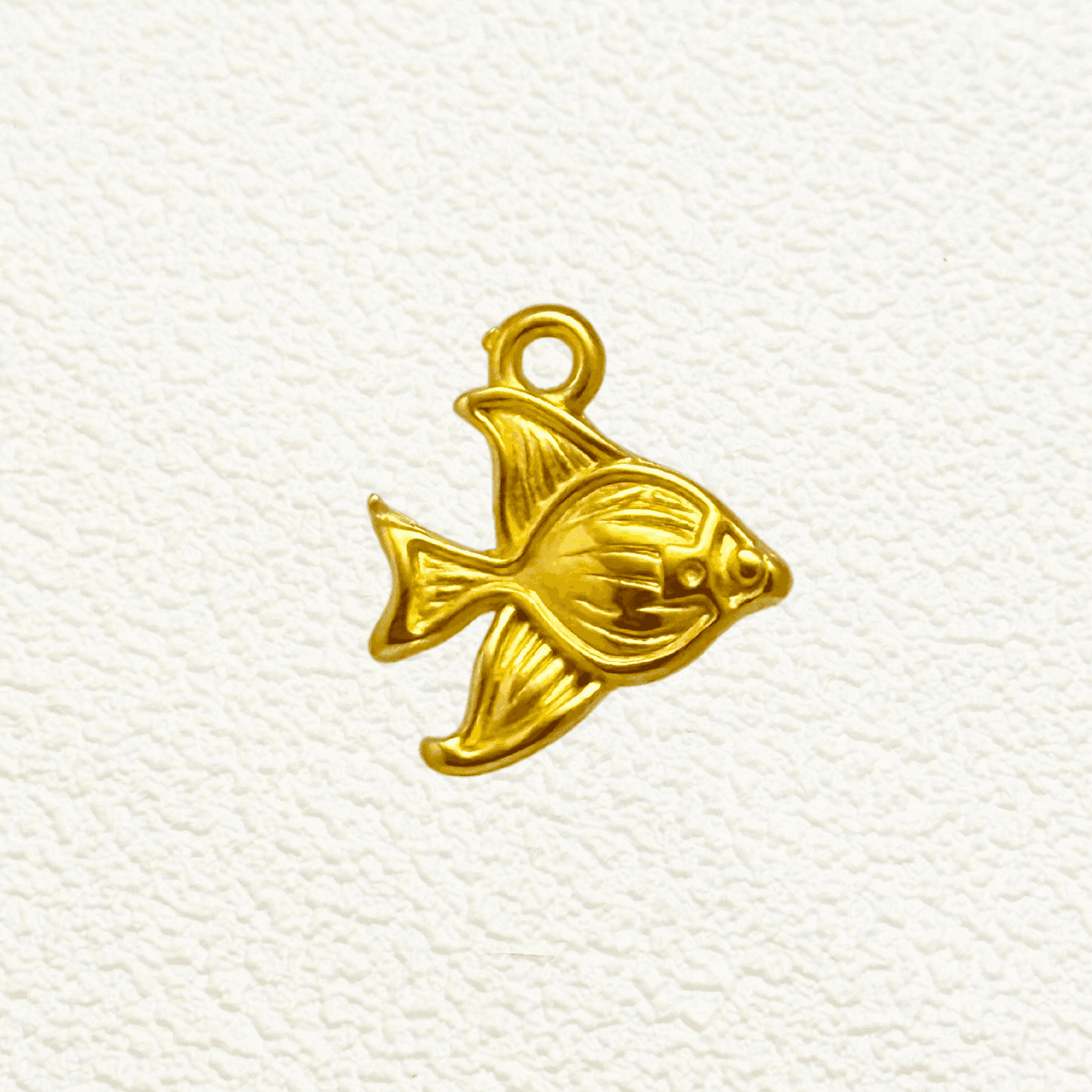 Gold angelfish charm with a smooth surface and detailed fin design