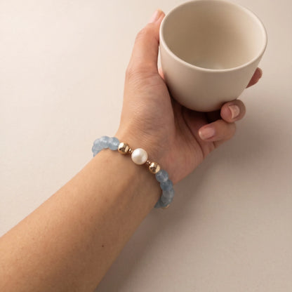 Aquamarine, pearl and initial gold bracelet featuring AAA-grade aquamarine beads, lustrous pearls and a personalised gold-filled stamped initial disc.