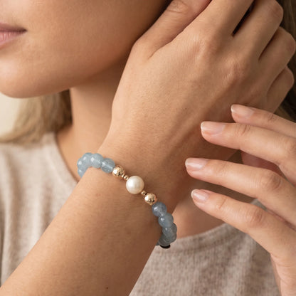 Aquamarine, pearl and initial gold bracelet featuring AAA-grade aquamarine beads, lustrous pearls and a personalised gold-filled stamped initial disc.