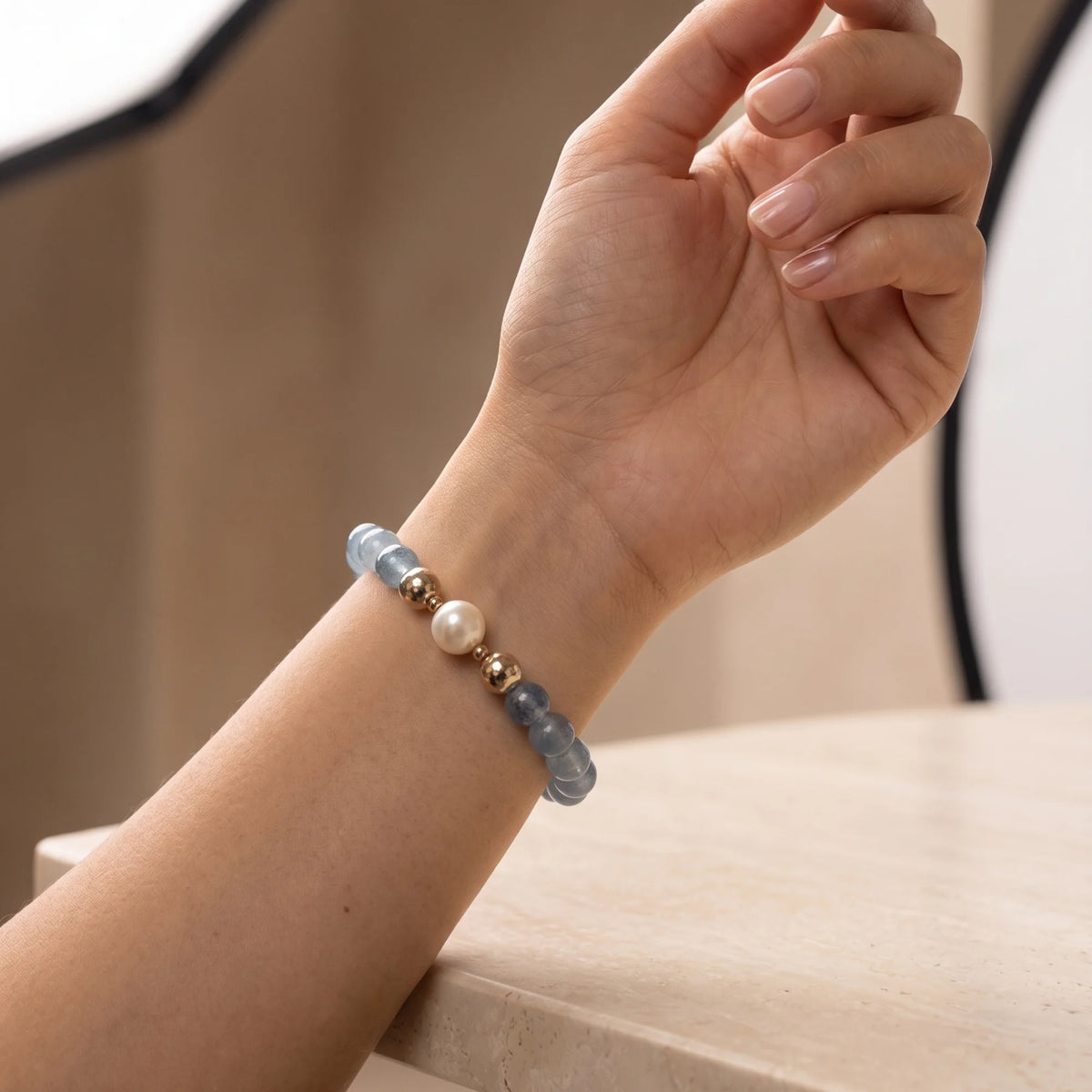 Aquamarine, pearl and initial gold bracelet featuring AAA-grade aquamarine beads, lustrous pearls and a personalised gold-filled stamped initial disc.