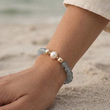 Aquamarine, pearl and initial gold bracelet featuring AAA-grade aquamarine beads, lustrous pearls and a personalised gold-filled stamped initial disc.