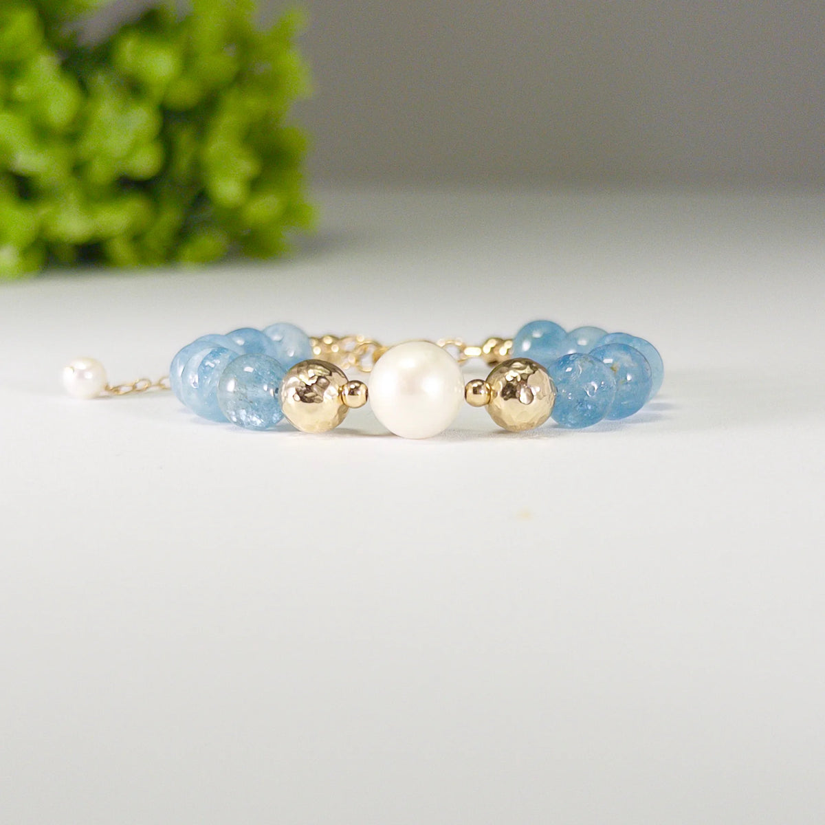 Aquamarine, pearl and initial gold bracelet featuring AAA-grade aquamarine beads, lustrous pearls and a personalised gold-filled stamped initial disc.