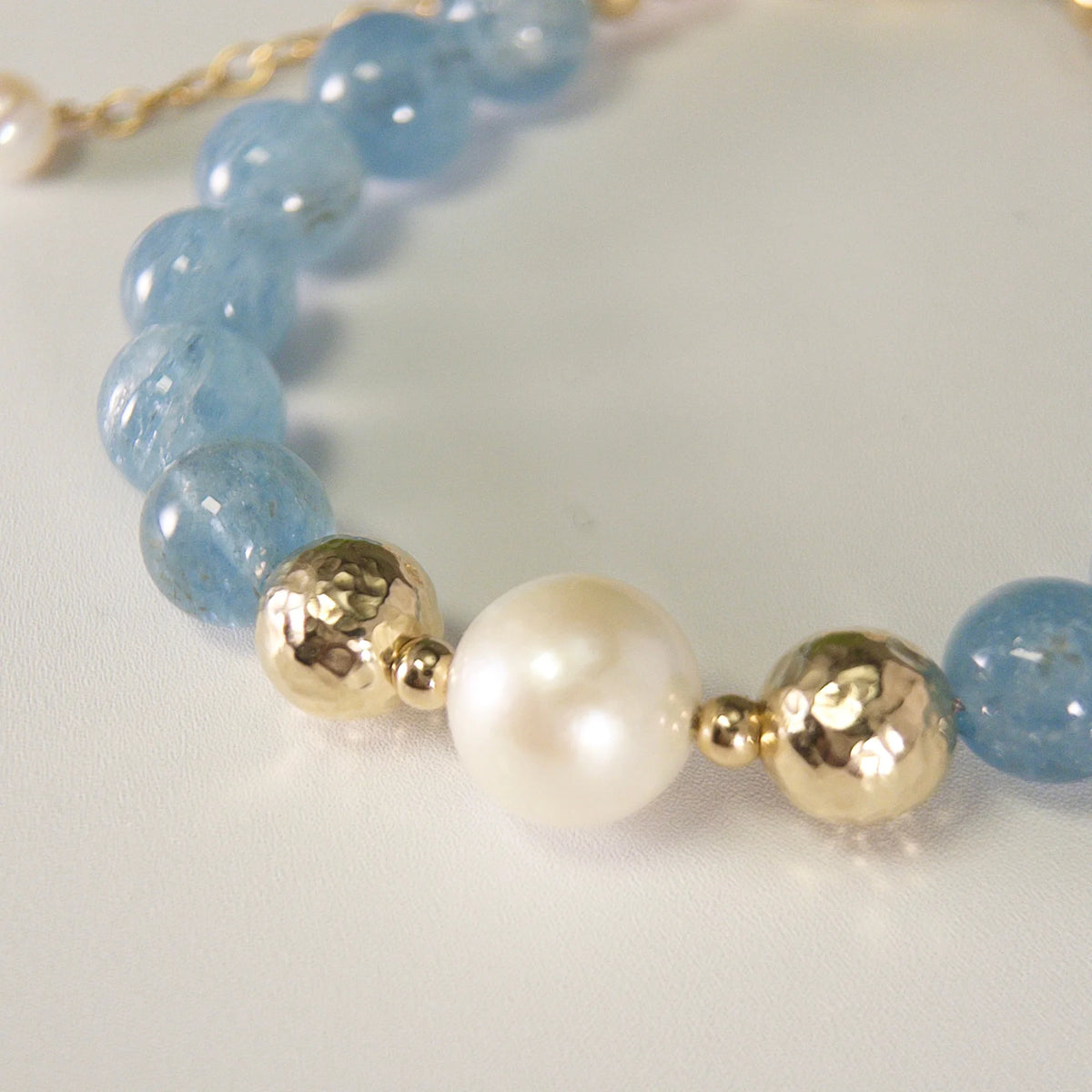 Aquamarine, pearl and initial gold bracelet featuring AAA-grade aquamarine beads, lustrous pearls and a personalised gold-filled stamped initial disc.