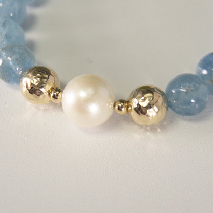 Aquamarine, pearl and initial gold bracelet featuring AAA-grade aquamarine beads, lustrous pearls and a personalised gold-filled stamped initial disc.