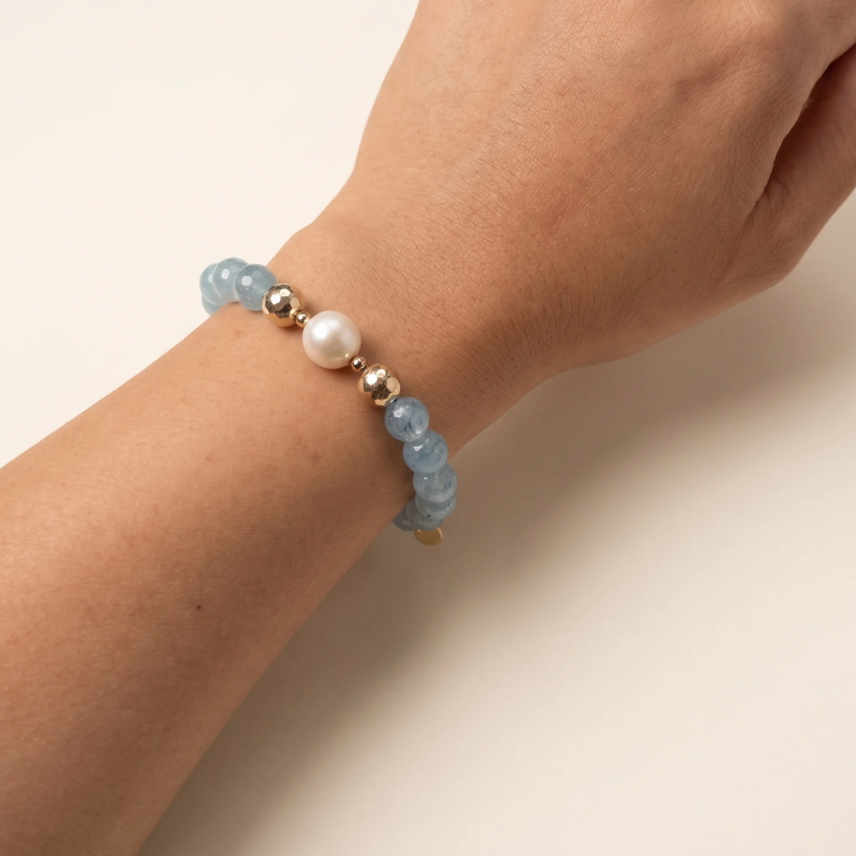 Aquamarine, pearl and initial gold bracelet featuring AAA-grade aquamarine beads, lustrous pearls and a personalised gold-filled stamped initial disc.