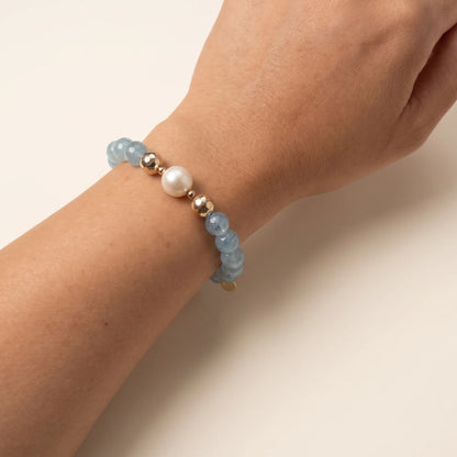 Aquamarine, pearl and initial gold bracelet featuring AAA-grade aquamarine beads, lustrous pearls and a personalised gold-filled stamped initial disc.