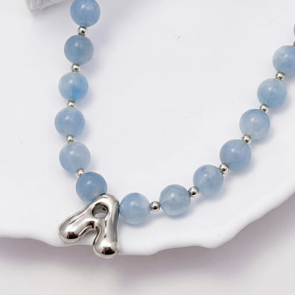 Aquamarine Silver Bubble Initial Necklace with natural aquamarine beads, sterling silver accents and personalised silver initial charm – MXW Jewellery