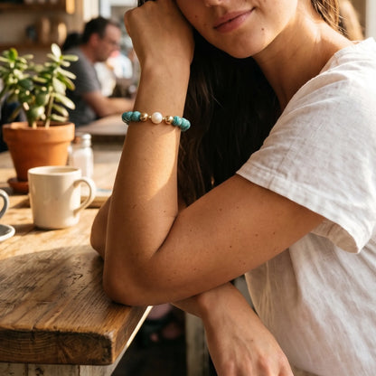A beaded bracelet featuring banded amazonite gemstone beads, premium freshwater pearl, and personalised stamped initial disc, 14k gold filled. MXW Jewellery