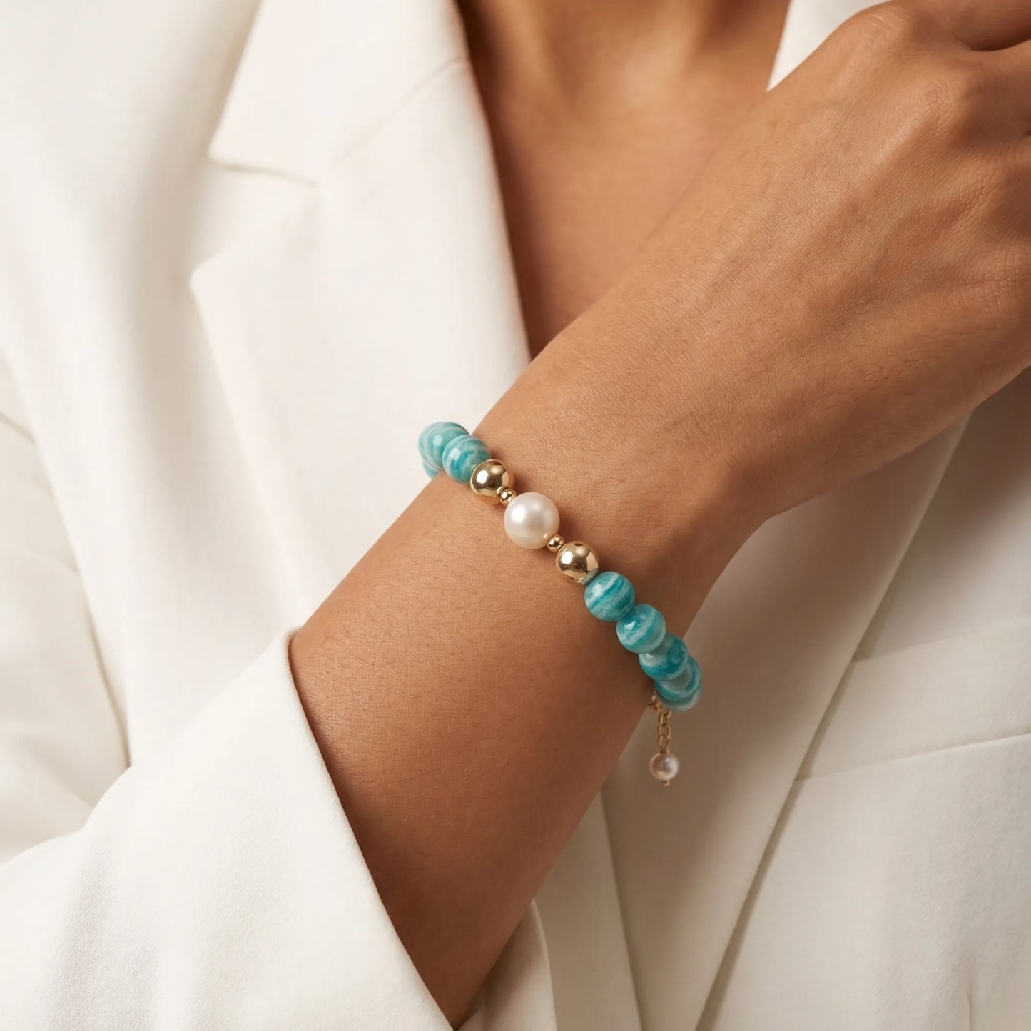 A beaded bracelet featuring banded amazonite gemstone beads, premium freshwater pearl, and personalised stamped initial disc, 14k gold filled. MXW Jewellery
