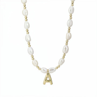 Premium baroque freshwater pearl and 14K gold filled beaded necklace with personalised gold bubble initial charm, hand-finished in Australia