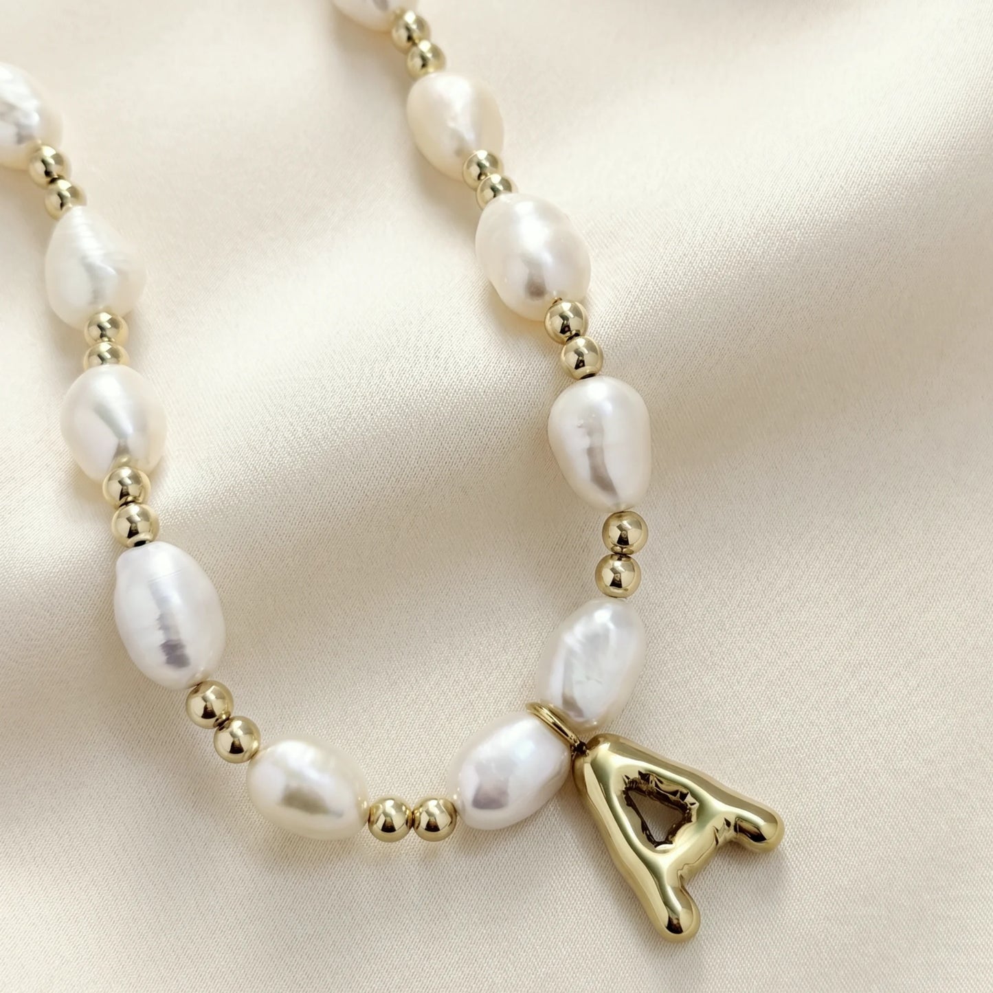 Premium baroque freshwater pearl and 14K gold filled beaded necklace with personalised gold bubble initial charm, hand-finished in Australia