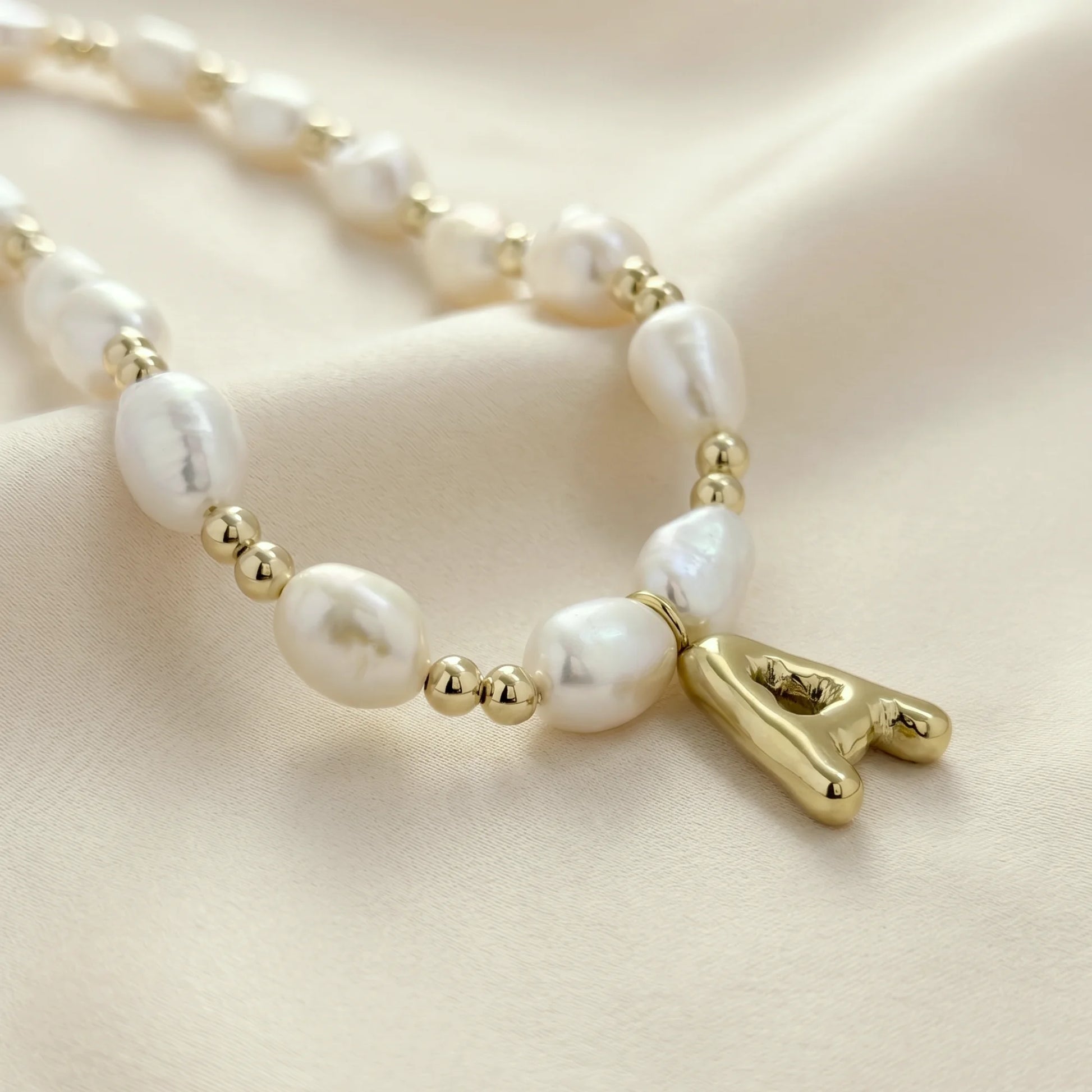 Premium baroque freshwater pearl and 14K gold filled beaded necklace with personalised gold bubble initial charm, hand-finished in Australia