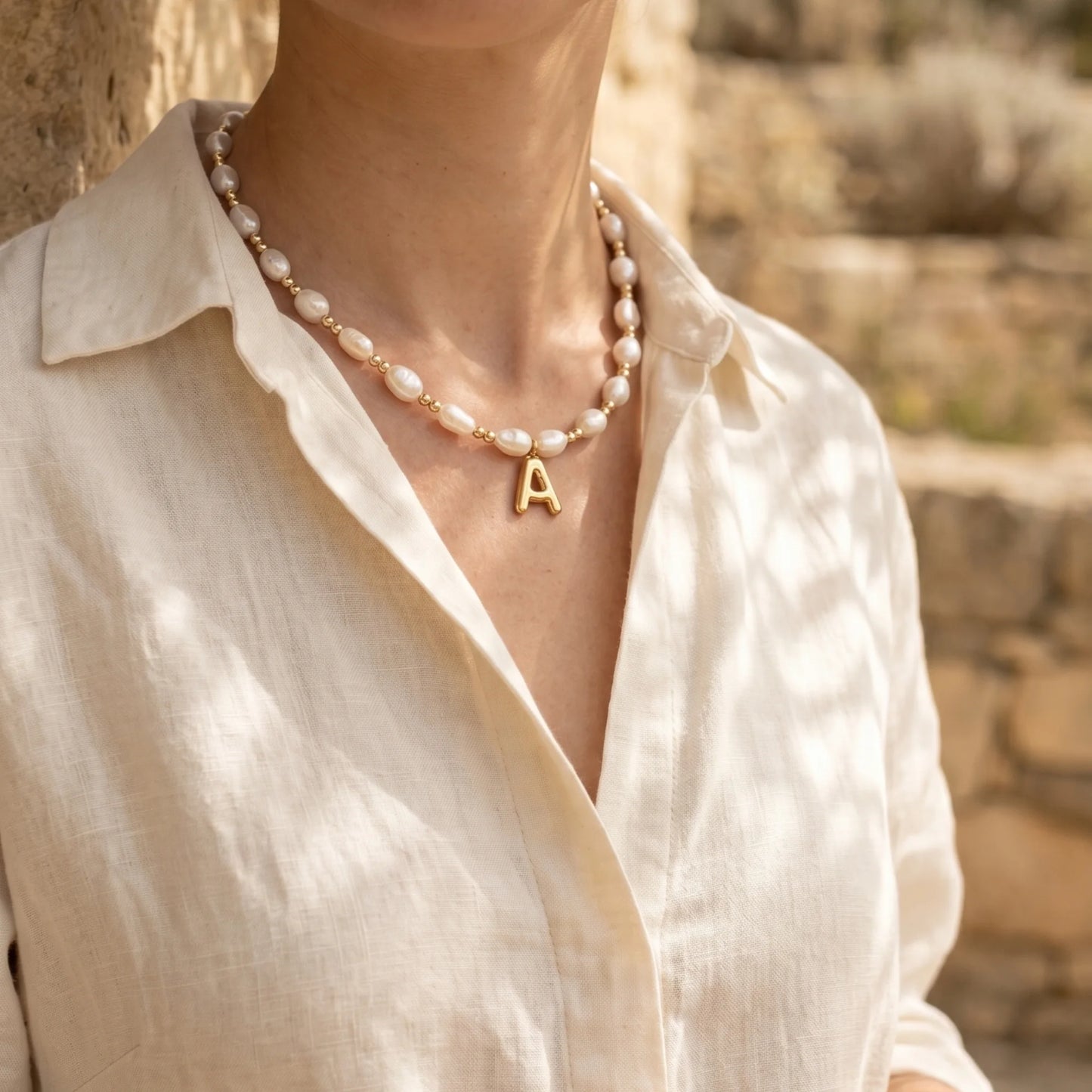Premium baroque freshwater pearl and 14K gold filled beaded necklace with personalised gold bubble initial charm, hand-finished in Australia