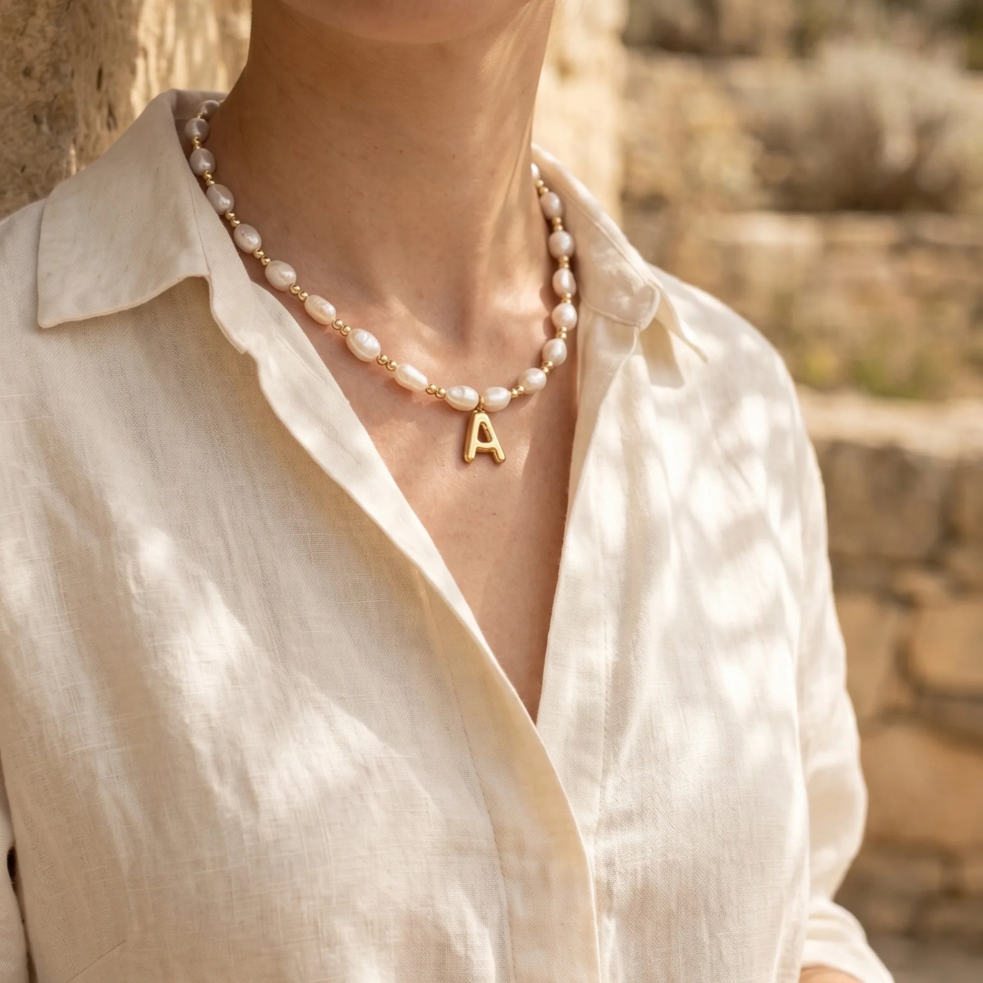 Premium baroque freshwater pearl and 14K gold filled beaded necklace with personalised gold bubble initial charm, hand-finished in Australia