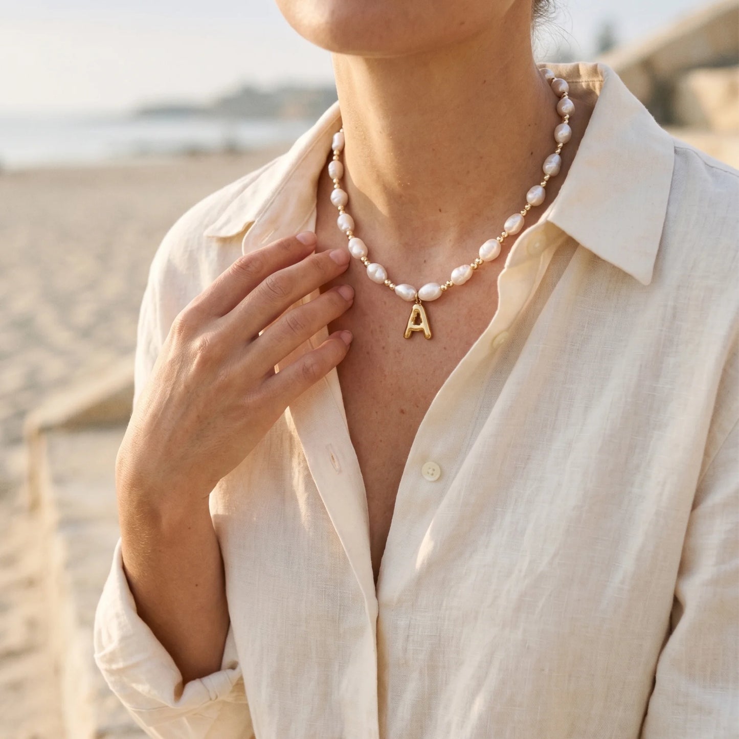Premium baroque freshwater pearl and 14K gold filled beaded necklace with personalised gold bubble initial charm, hand-finished in Australia