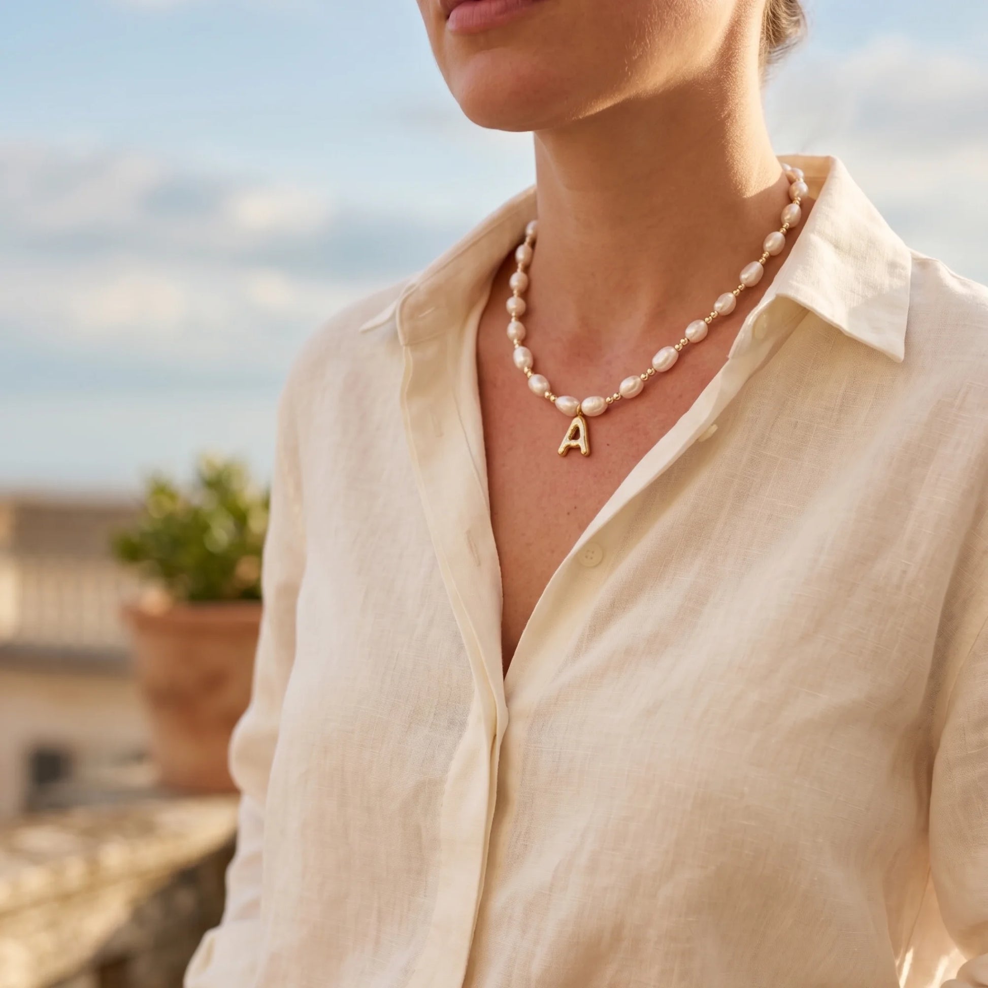 Premium baroque freshwater pearl and 14K gold filled beaded necklace with personalised gold bubble initial charm, hand-finished in Australia