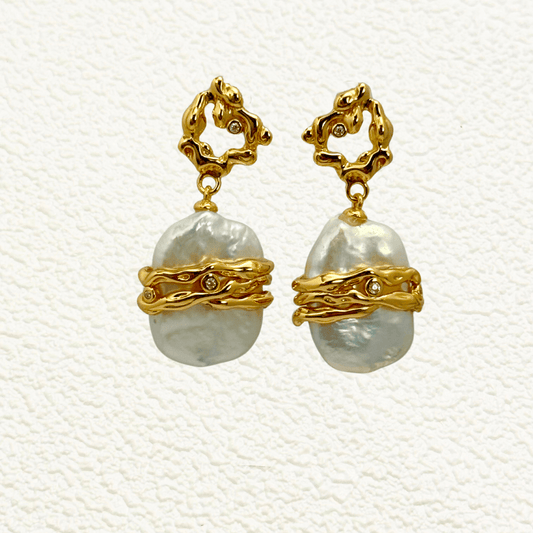 earrings with baroque freshwater pearls wrapped in sculptural gold wave bands and organic textured gold studs