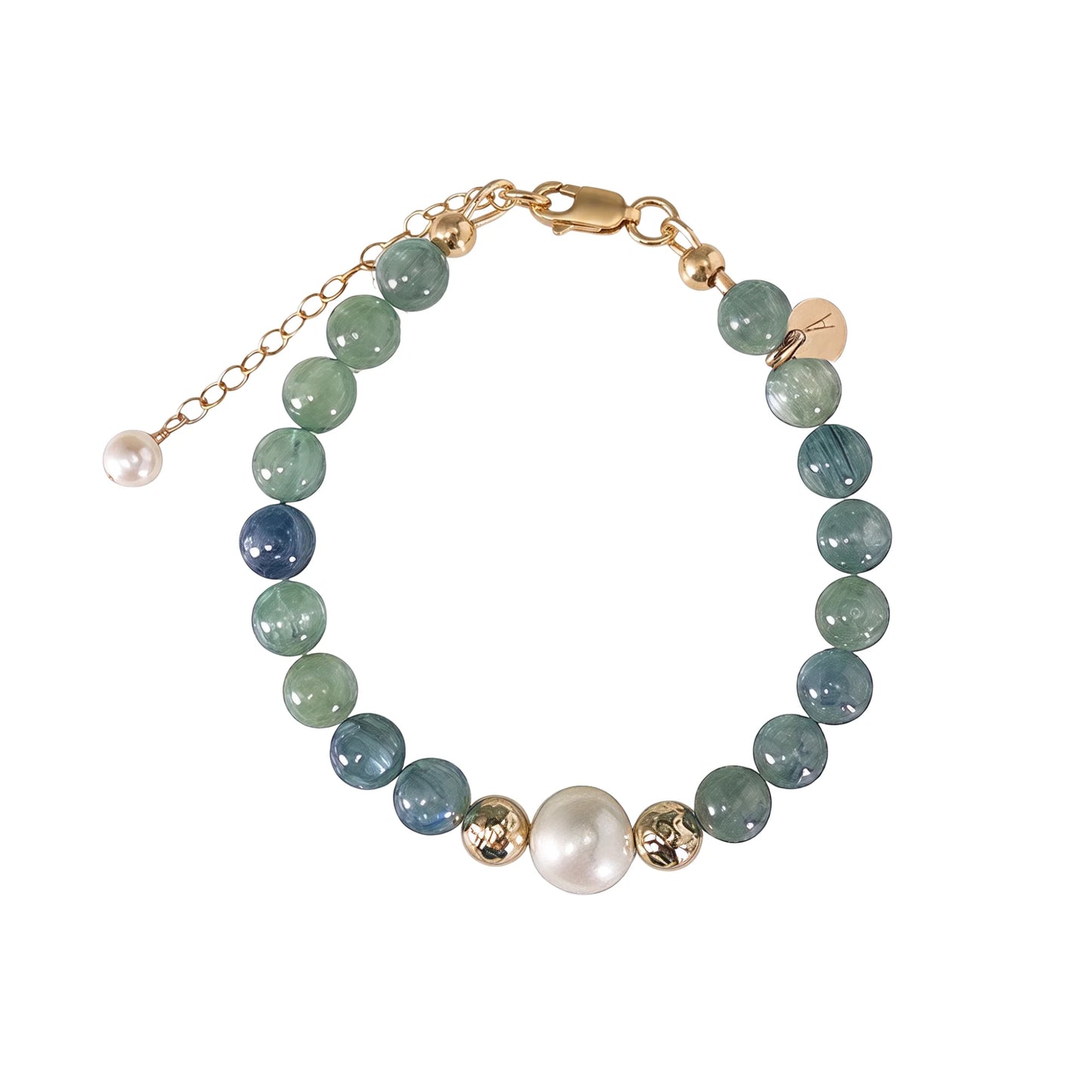Bicolor kyanite, pearl and initial gold bracelet featuring naturally zoned blue-green gemstone beads, lustrous freshwater pearls and a personalised gold-filled stamped initial disc.