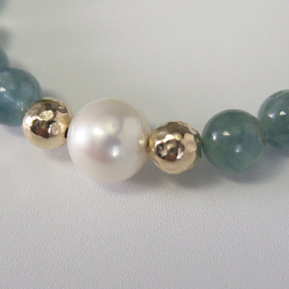 Bicolor kyanite, pearl and initial gold bracelet featuring naturally zoned blue-green gemstone beads, lustrous freshwater pearls and a personalised gold-filled stamped initial disc.