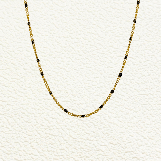 PVD gold stainless steel chain with black enamel dot accents, versatile as necklace, bracelet, or anklet