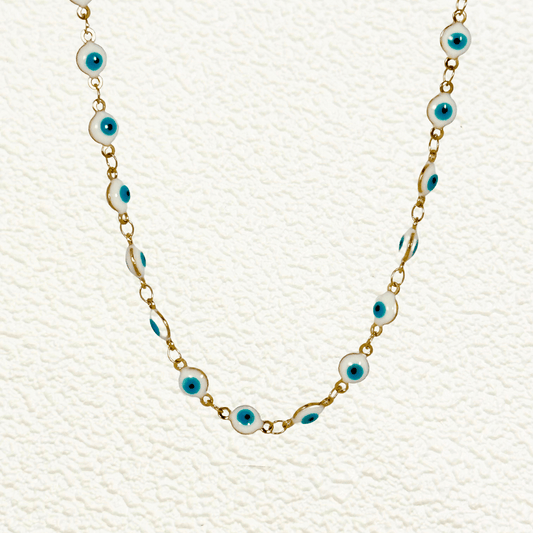 Gold chain with white and blue enamel evil eye charms linked in a waterproof, tarnish-resistant design.