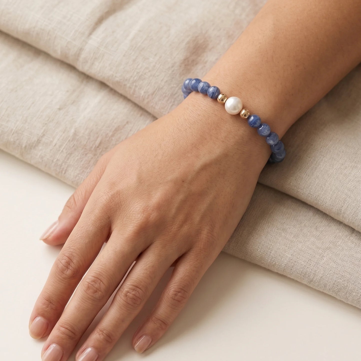 Blue kyanite, pearl and initial gold bracelet featuring Brazilian blue kyanite beads, lustrous freshwater pearls and a personalised gold-filled stamped initial disc.
