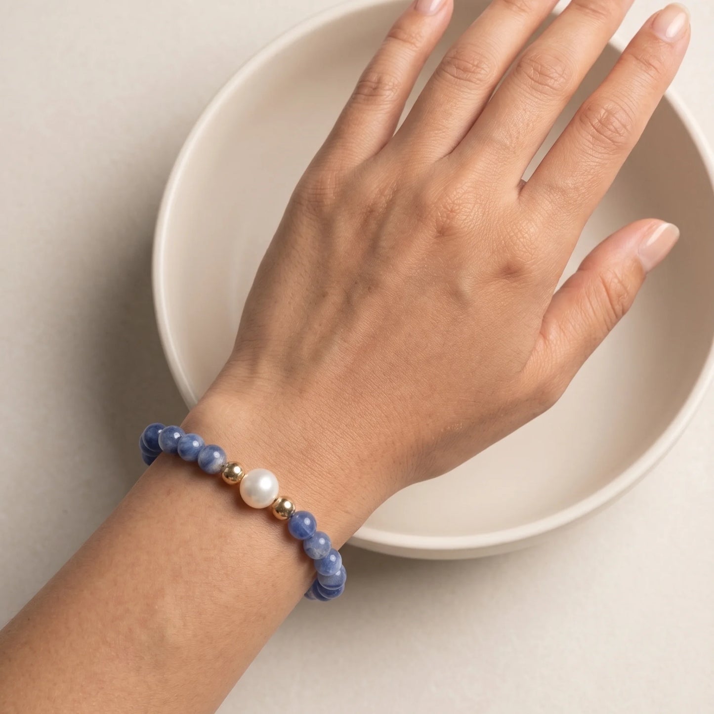 Blue kyanite, pearl and initial gold bracelet featuring Brazilian blue kyanite beads, lustrous freshwater pearls and a personalised gold-filled stamped initial disc.