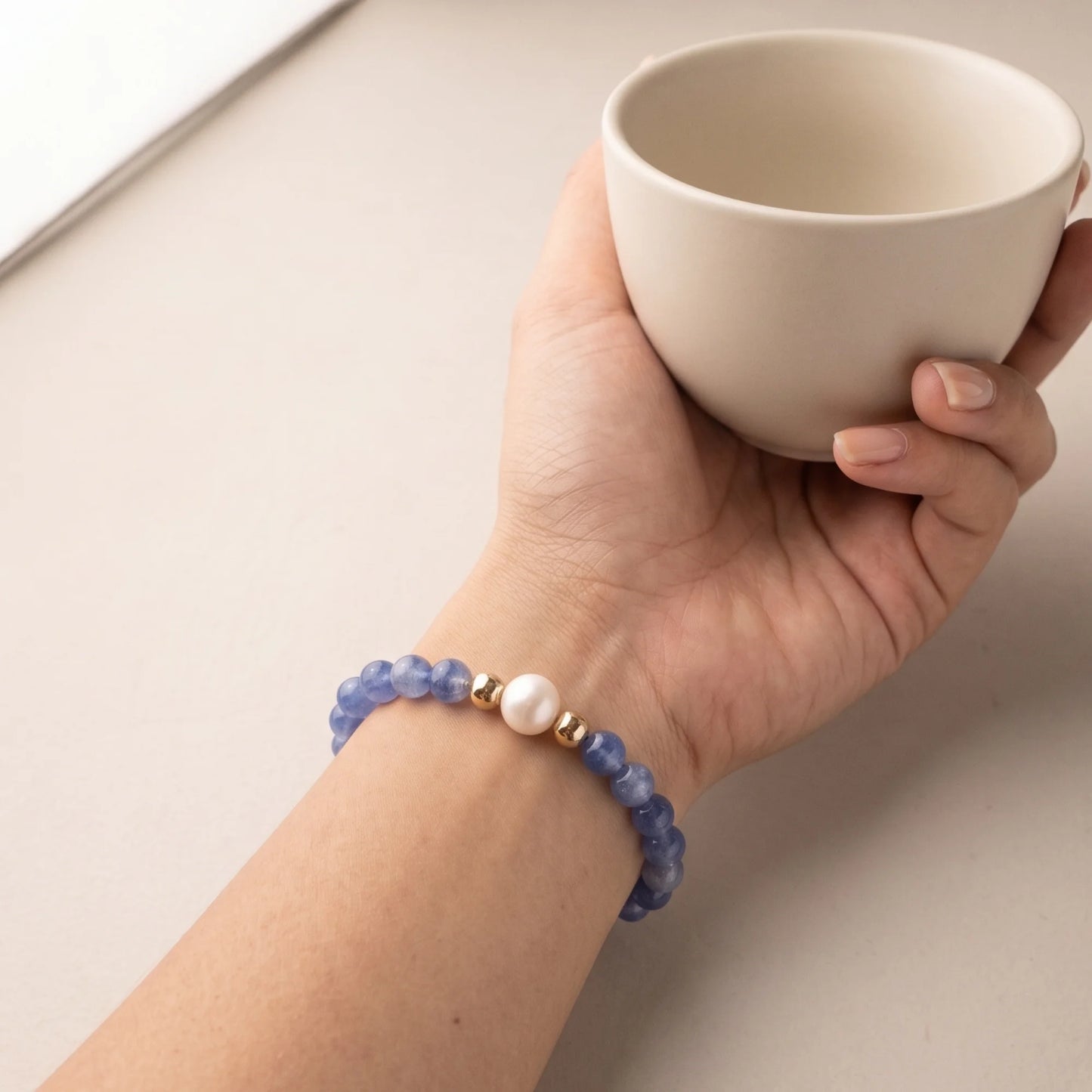 Blue kyanite, pearl and initial gold bracelet featuring Brazilian blue kyanite beads, lustrous freshwater pearls and a personalised gold-filled stamped initial disc.
