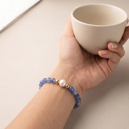Blue kyanite, pearl and initial gold bracelet featuring Brazilian blue kyanite beads, lustrous freshwater pearls and a personalised gold-filled stamped initial disc.