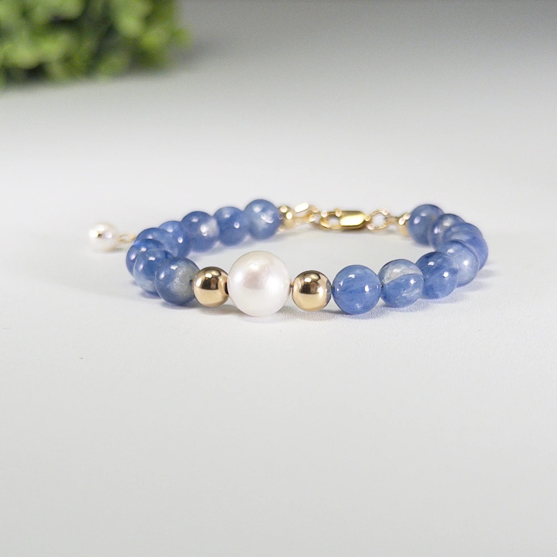 Blue kyanite, pearl and initial gold bracelet featuring Brazilian blue kyanite beads, lustrous freshwater pearls and a personalised gold-filled stamped initial disc.