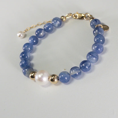 Blue kyanite, pearl and initial gold bracelet featuring Brazilian blue kyanite beads, lustrous freshwater pearls and a personalised gold-filled stamped initial disc.