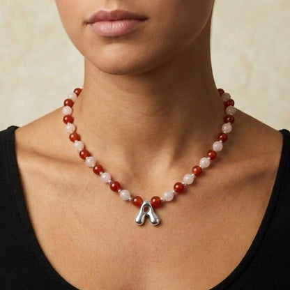 personalised necklace with alternating carnelian and pink morganite beads, silver spacers and bubble initial letter.