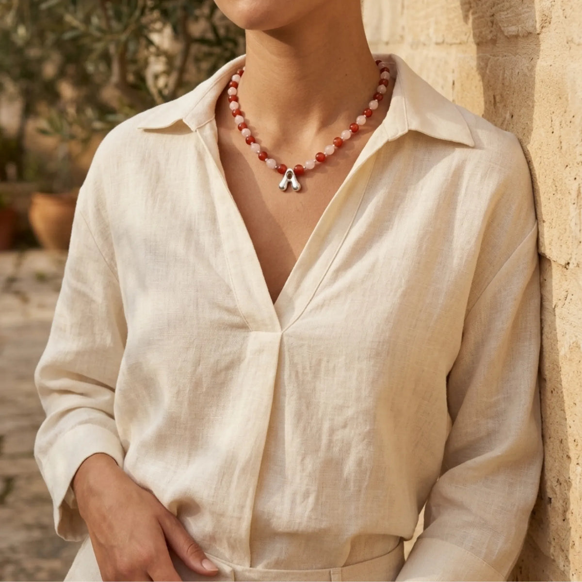 personalised necklace with alternating carnelian and pink morganite beads, silver spacers and bubble initial letter.