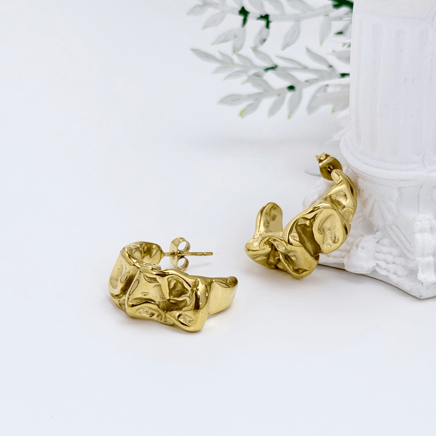 Chunky molten-textured vintage gold hoop earrings with sculpted irregular surface.