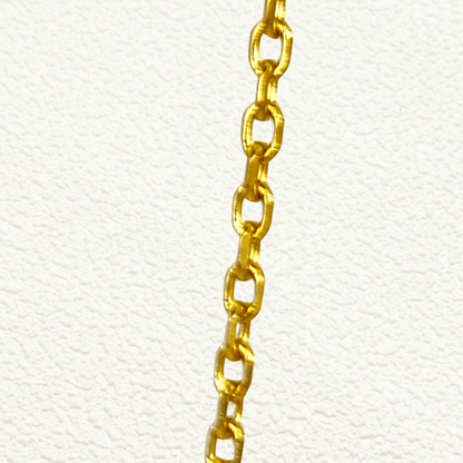 Gold cable chain made of fine interlocking links in a classic minimalist style, available as necklace, bracelet, or anklet
