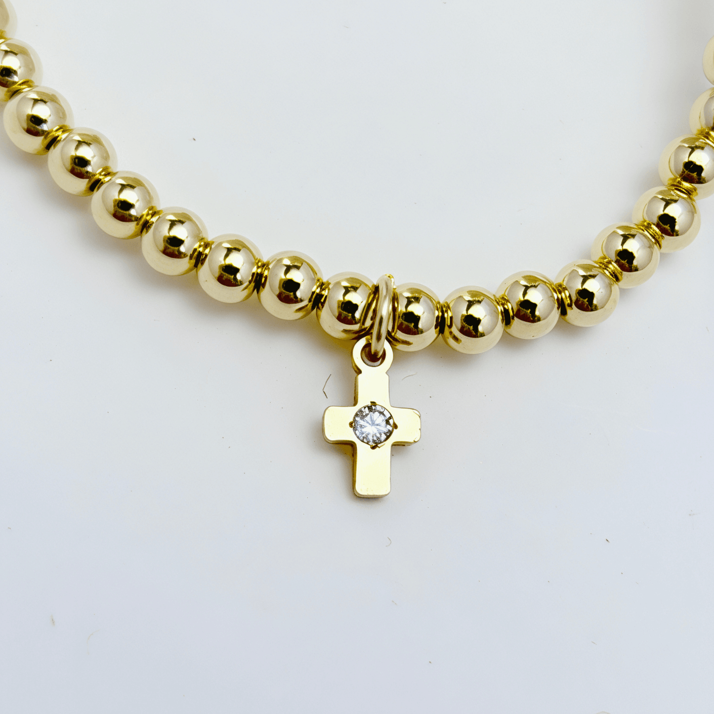 Cross charm gold bead bracelet with crystal detail and polished gold-filled beads – MXW Jewellery