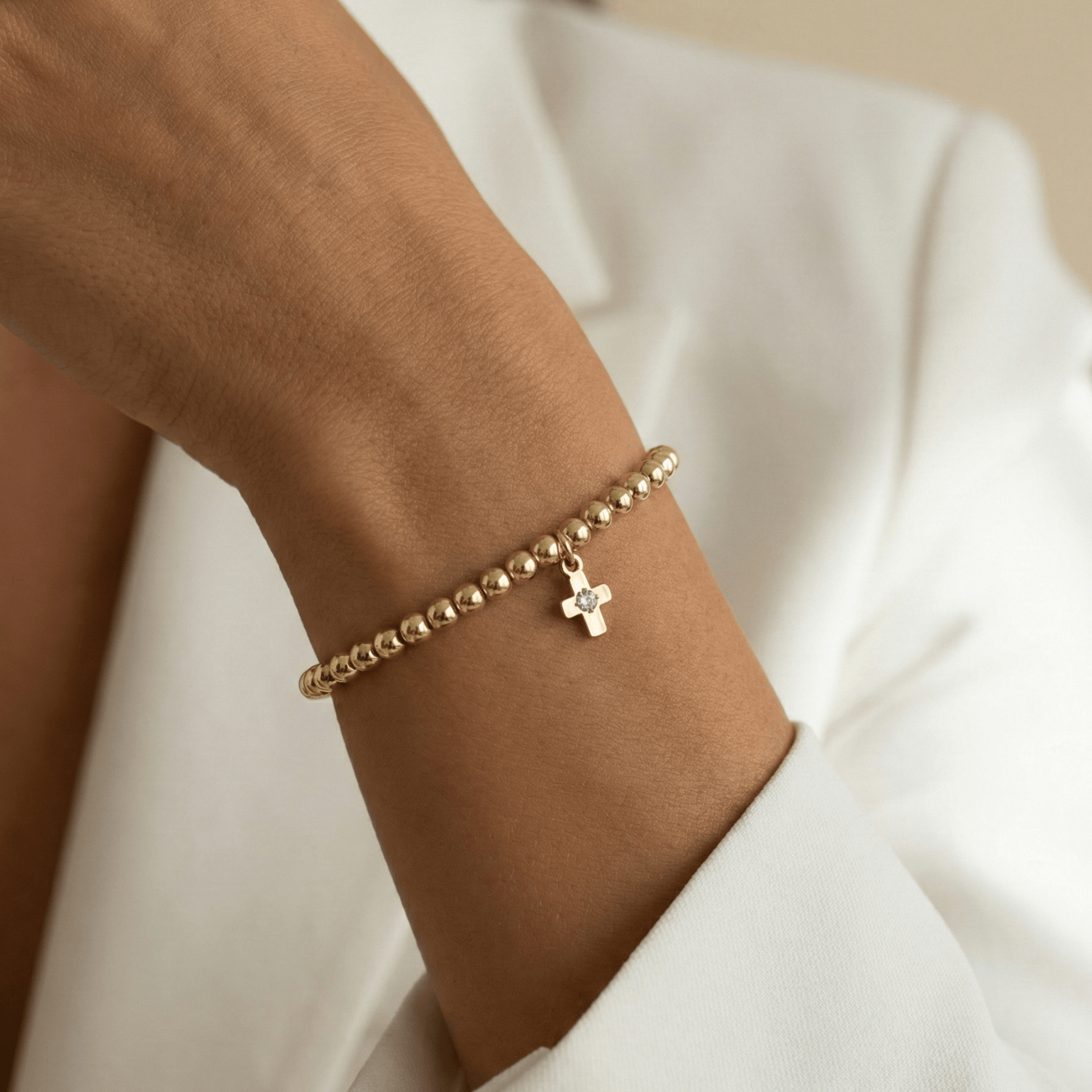 Cross charm gold bead bracelet with crystal detail and polished gold-filled beads – MXW Jewellery
