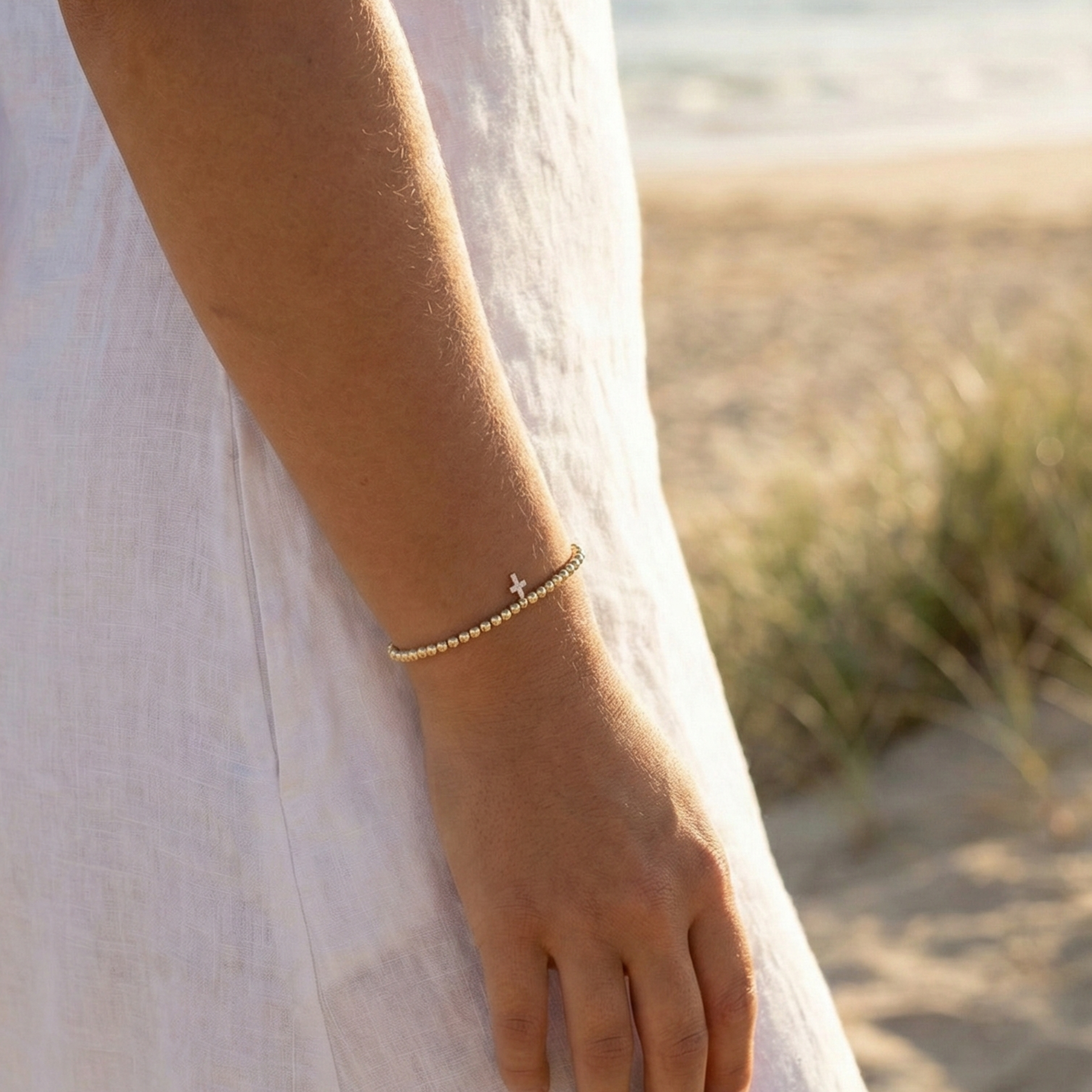 Cross charm gold bead bracelet with crystal detail and polished gold-filled beads – MXW Jewellery