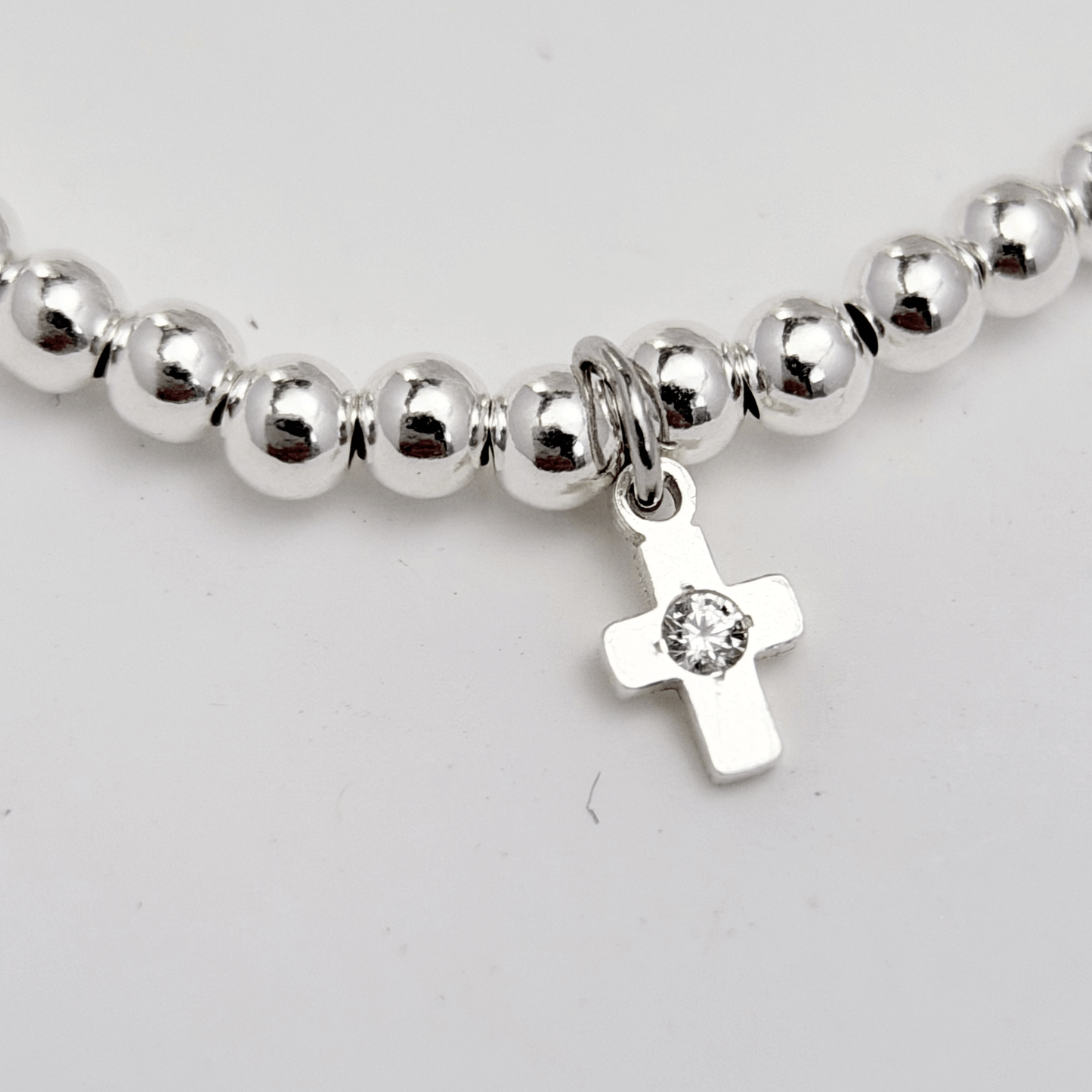 Cross charm sterling silver bead bracelet with crystal detail and polished silver beads – MXW Jewellery