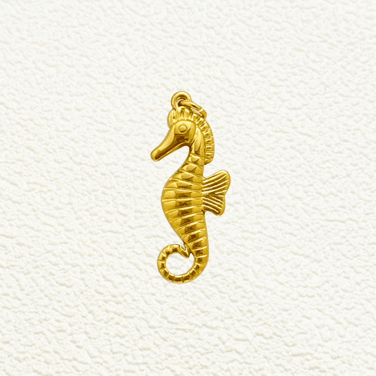 Gold Curled Fin Seahorse Charm with textured lines and raised eye detail