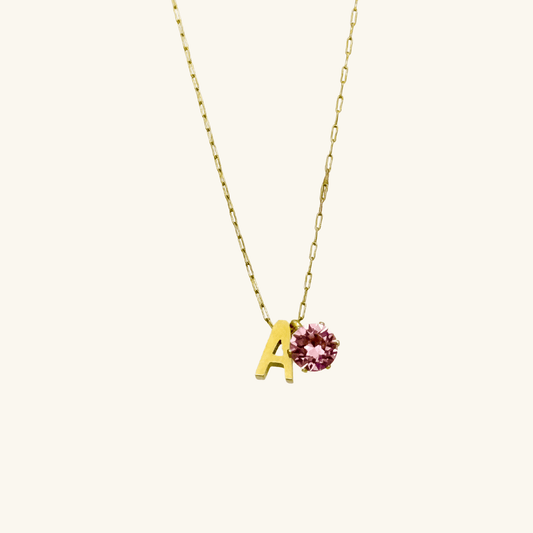 Personalized initial necklace featuring a Swarovski crystal charm on a delicate 1 mm chain, in gold and silver, hypoallergenic and tarnish-resistant.