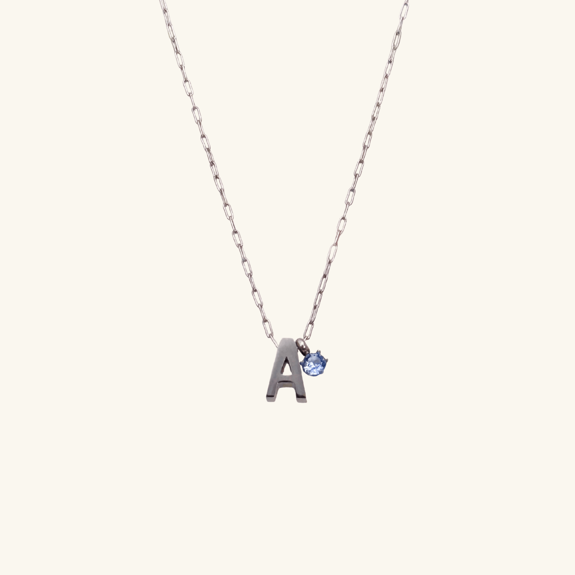Personalized initial necklace featuring a Swarovski crystal charm on a delicate 1 mm chain, in gold and silver, hypoallergenic and tarnish-resistant.
